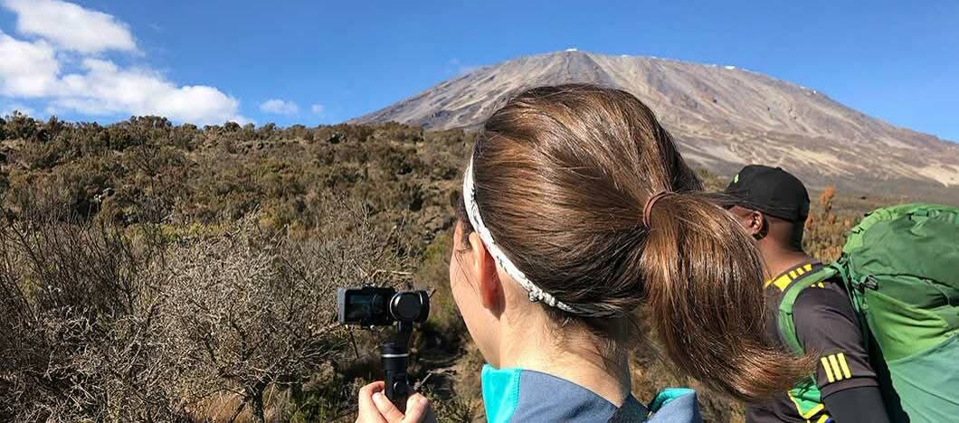 NGULI climber filming the view towards Kibo on the Machame Route