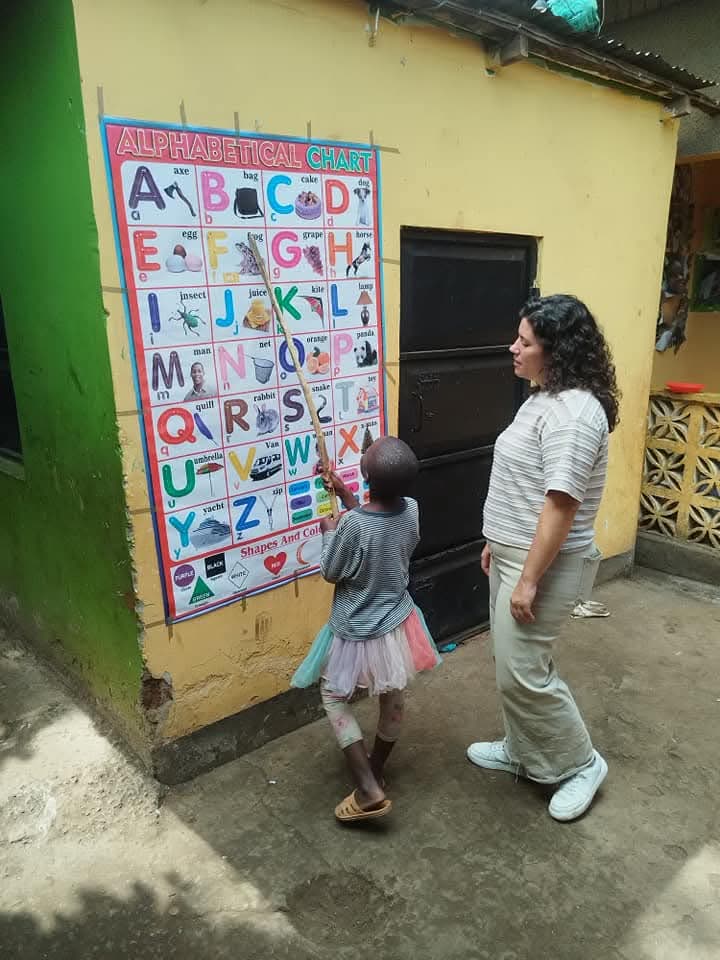 NGULI volunteer teaching at a local school